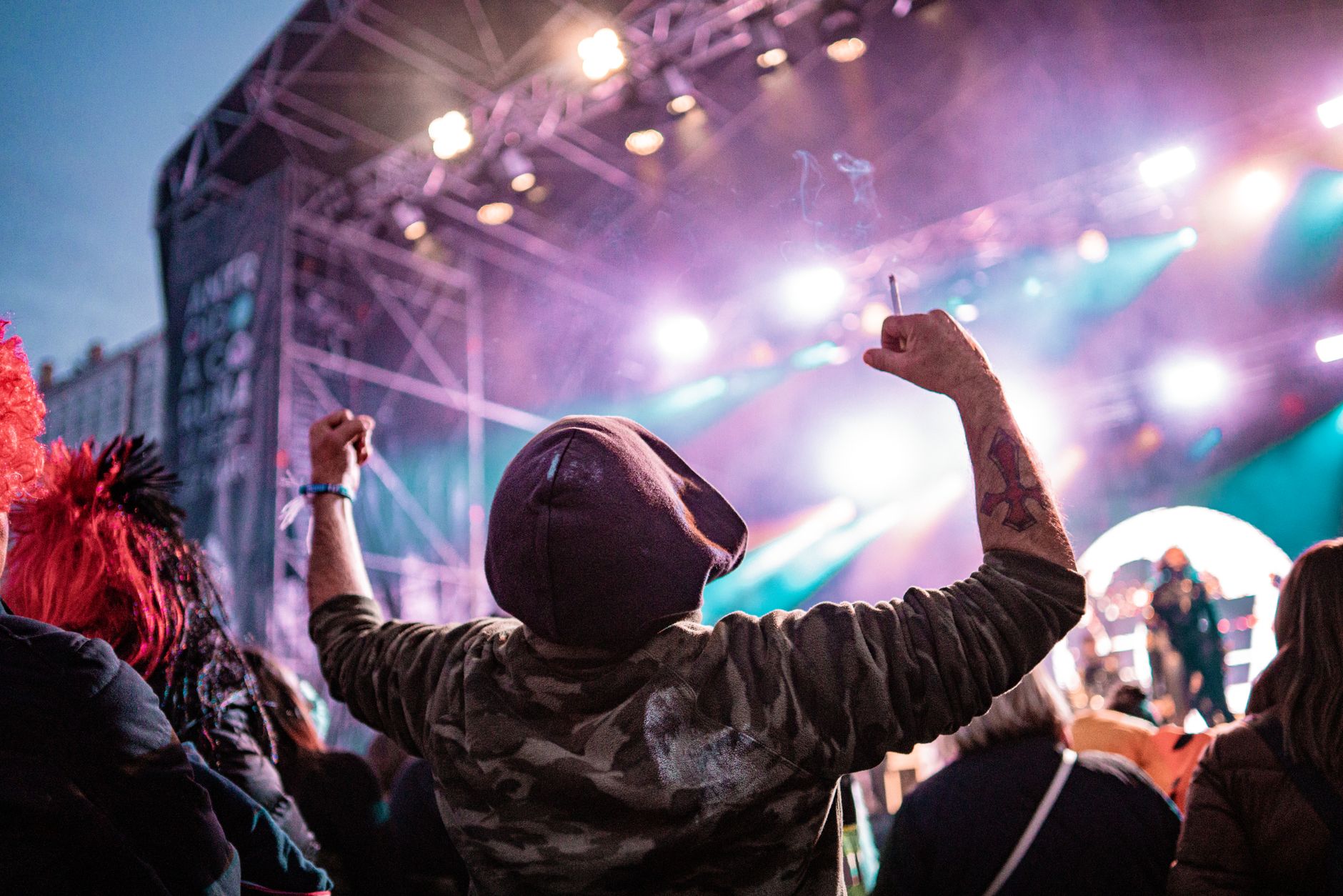 Energetic crowd at a live music festival in A Coruña, Spain, at night.